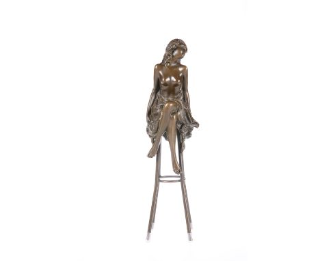 A BRONZE FIGURE OF A SEMI-NUDE MAIDEN, cast seated on a stool. 27cm