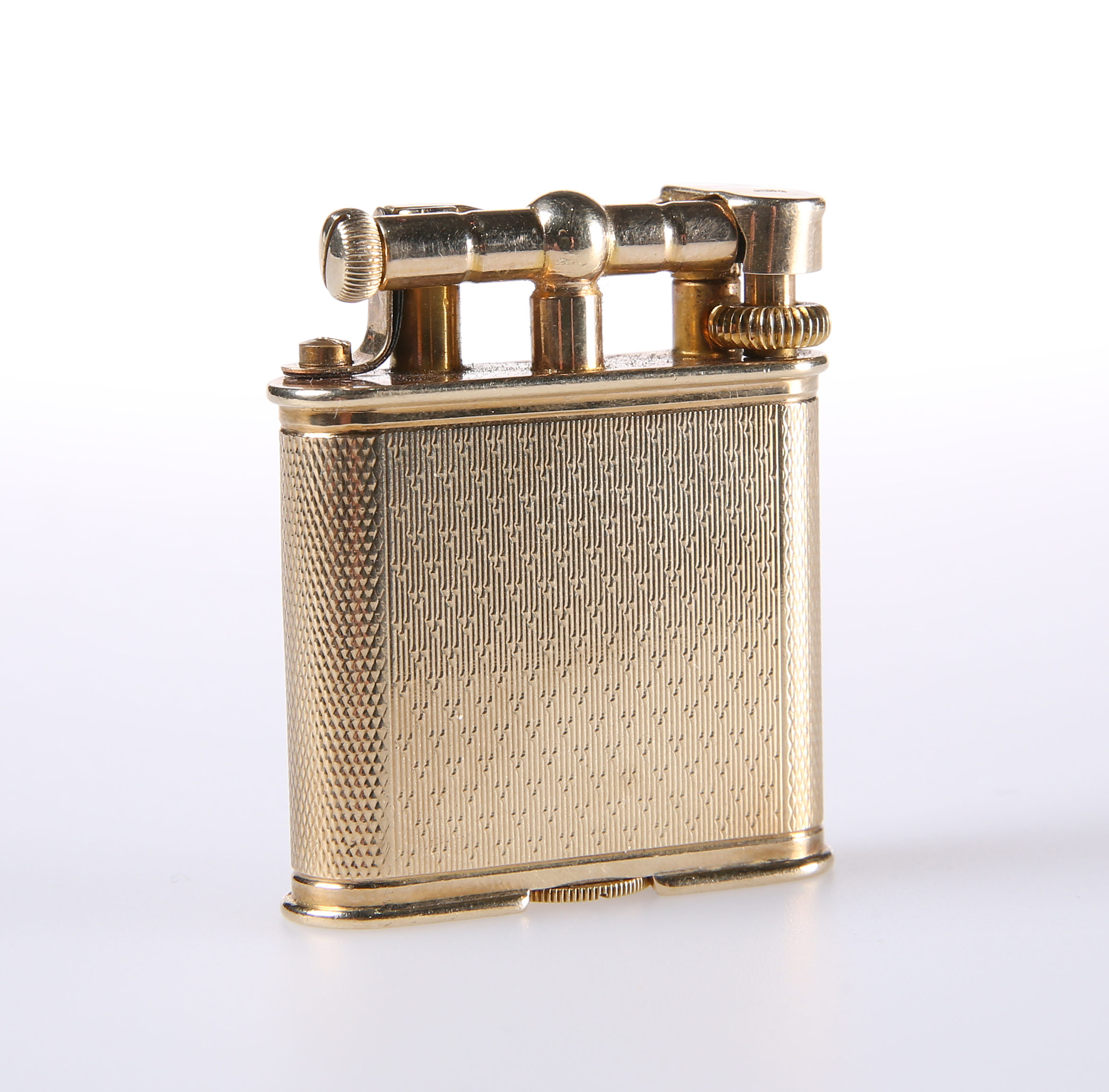 AN ALFRED DUNHILL 9 CARAT GOLD LIGHTER, LONDON 1932, the engine-turned ...