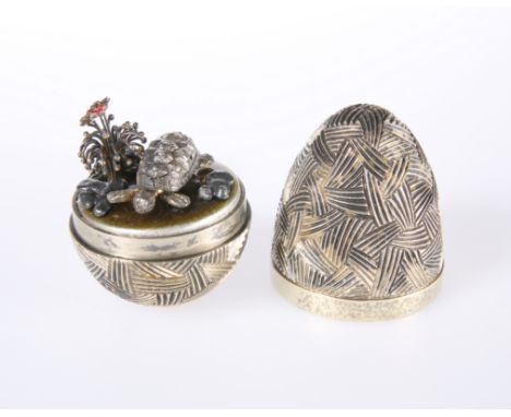STUART DEVLIN, A SILVER-GILT AND ENAMEL SURPRISE EGG, LONDON 1979, with "woven" pattern exterior, opening to a tortoise and f
