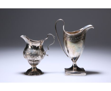 TWO GEORGE III SILVER CREAM JUGS, the first London 1792, with bright-cut engraving; the second London 1779, embossed with flo