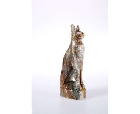 A CARVED STONE MODEL OF A SEATED CAT IN EGYPTIAN STYLE. 16.5cm