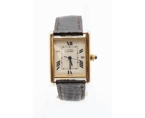 A CARTIER TANK VERMEIL WATCH. Rectangular ivory dial with roman indexes at even number positions, central seconds hand, blued