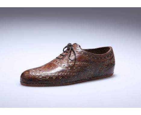A COLD-PAINTED BRONZE MODEL OF A BROGUE, c. 1900, realistically modelled, with laces. Length 12.5cm