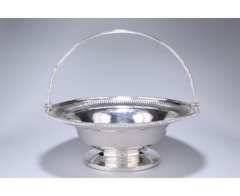 A GEORGE III SILVER CAKE BASKET, PAUL STORR, LONDON 1805, circular, with leaf-cast reeded swing handle, the basket with gadro