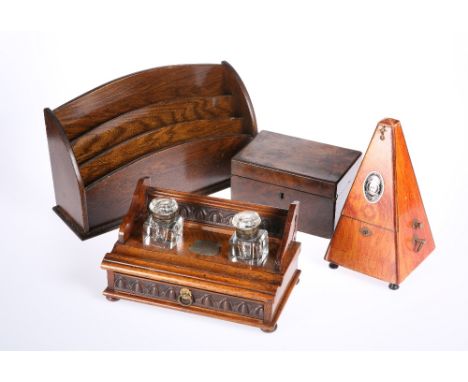 A VICTORIAN OAK DESK STAND, together with A SYSTEM MAELZEL METRONOME, 21.5cm; A VICTORIAN WALNUT BOX AND AN OAK LETTER RACK. 