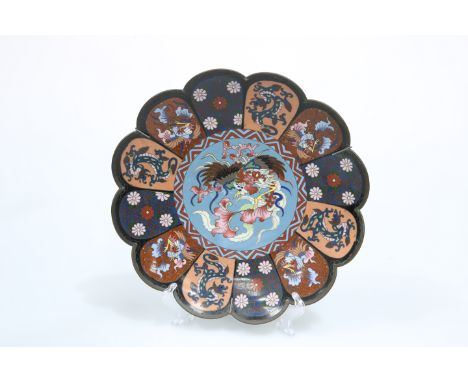 A JAPANESE CLOISONNE ENAMEL PETAL-SHAPED DISH, MEIJI PERIOD, the centre decorated with a phoenix, the outer panels decorated 