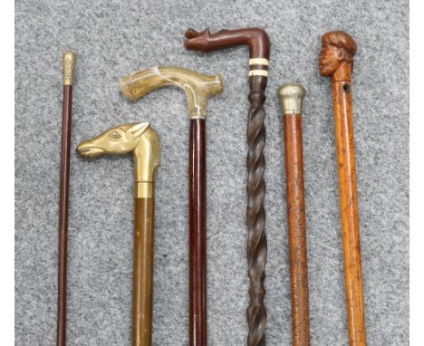 A GROUP OF STICKS, to include a Sherwood Foresters swagger stick, brass horse's head stick with concealed whisky flask, malac