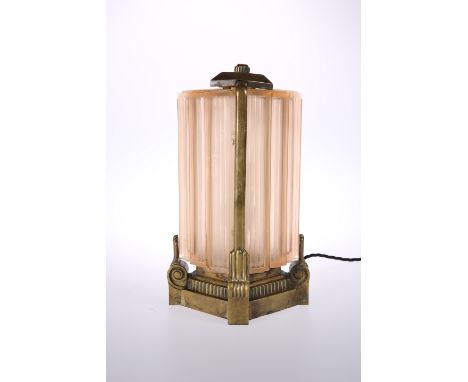A STRIKING BRONZE AND MOULDED GLASS TABLE LAMP IN THE ART DECO TASTE, probably French, c. 1930, the ribbed stepped pink opaqu