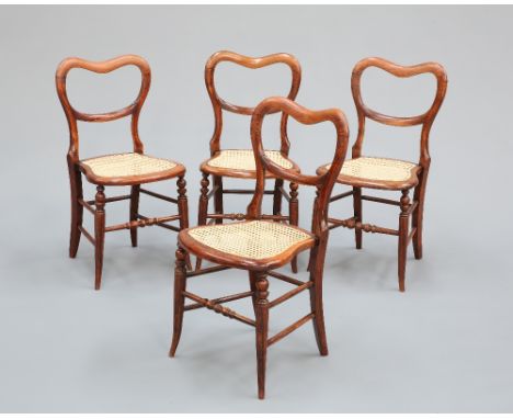 A SET OF FOUR VICTORIAN SIMULATED ROSEWOOD KIDNEY-BACKED CHAIRS, with caned spoon-shaped seats, raised on bobbin-turned and s