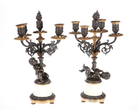 A PAIR OF 19TH CENTURY FRENCH PARCEL-GILT BRONZE AND ALABASTER FIGURAL CANDELABRA, each with four branches and five candle cu