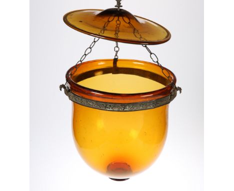 A VICTORIAN AMBER GLASS HANGING LIGHT DOME WITH ORIGINAL GLASS TOP, the base of the dome with moulded prunt, with metal with 