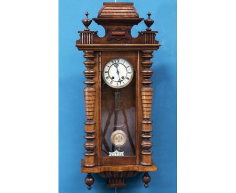 A 19TH CENTURY WALNUT VIENNA PATTERN WALL CLOCK, the enamel dial with Roman numerals, the two-train movement striking the hou