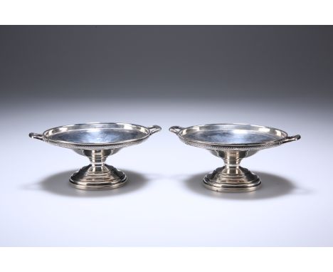 A PAIR OF GEORGE V SILVER BON BON DISHES, WILLIAM HAIR HASELER, BIRMINGHAM 1935, each with twin handles and stepped circular 