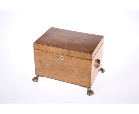 A REGENCY BURR YEW TEA CADDY, the hinged rectangular top opening to reveal twin lidded compartments, the sides applied with b