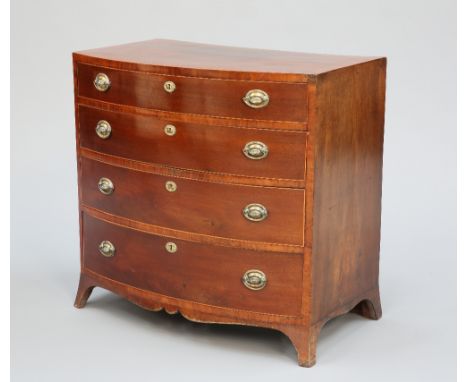 AN EARLY 19TH CENTURY MAHOGANY BOW-FRONT CHEST OF DRAWERS, the string inlaid top above four long graduated drawers, fitted wi