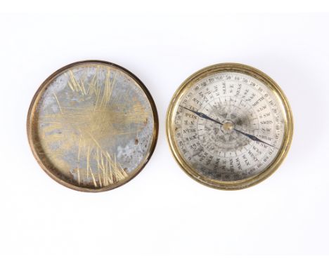 A 19TH CENTURY BRASS CASED COMPASS. 6cm diameter