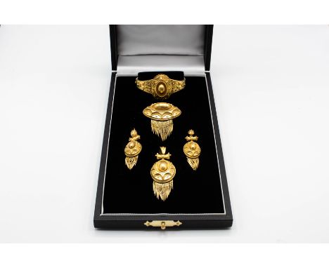 A MID VICTORIAN DEMI PARURE, comprising of locket pendant, locket brooch, earrings and bangle, each with domed centre, set th