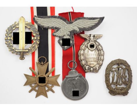 Nachlass eines Luftwaffen-Soldaten und SA-Angehörigen.1.) Kriegsverdienstkreuz, 2. Klasse mit Schwertern, 2.) Medaille Winter