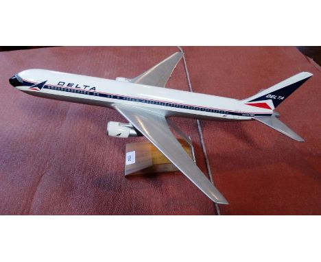 A scale model of a Boeing 767, carrying Delta livery, 54cm on display stand.