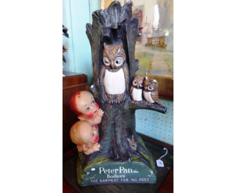 A 1930's department store display model, advertising Peter Pan Bodices, formed as a family of owls in a lit up tree trunk wit