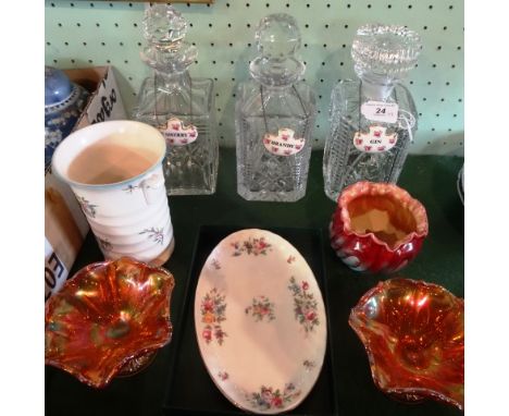 Three cut glass decanters, each with ceramic spirit labels, made by Royal Adderley, a late 19th century Bretby small planter,