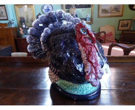 A large ceramic tureen, fashioned as a turkey, made in Portugal, 33cm tall. Condition Report: Several cracks - also cracks to