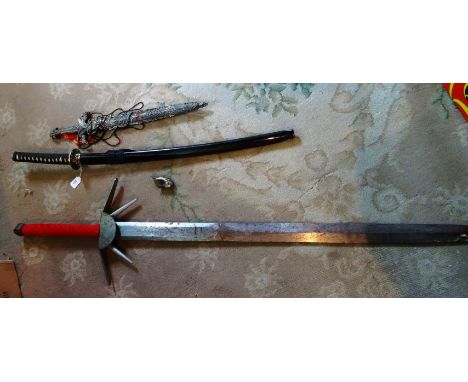 A modern Japanese sword and scabbard, a Far Eastern dagger and scabbard and a decorative sword.