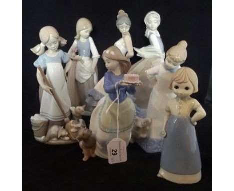 A Lladro figure of a girl playing with kittens, no. 5232, together with six Nao figurines, various sizes.