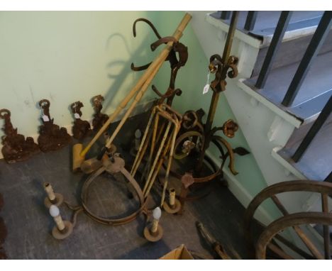 A quantity of 19th century wrought iron plant stands, a circular iron chandelier and a part-croquet set. 