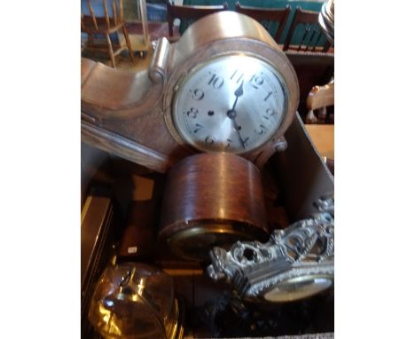 Two early 20th century oak cased mantle clocks, together with a West German brass clock in the 18th century style, a mid-20th