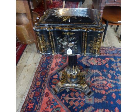 A Regency gilt and mother of pearl decorated teapoy with twin glass tea cannister on central column and quadraform base. Cond