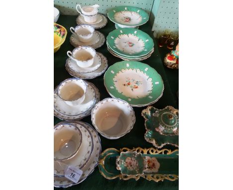 A quantity of 19th century florally decorated plates with matching comport, together with 19th century green and gilt ceramic