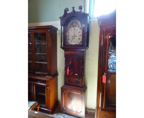 A mid-19th century flame mahogany eight day longcase clock, the pained moon face bearing Roman numerals and the name Richards