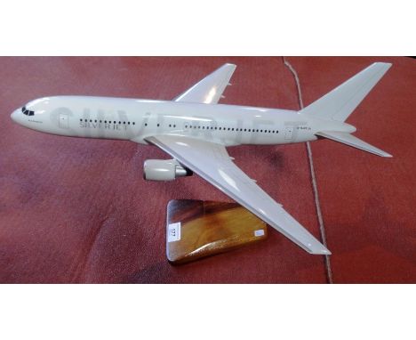 A scale model of a Silverjet aircraft, 47cm on display stand.