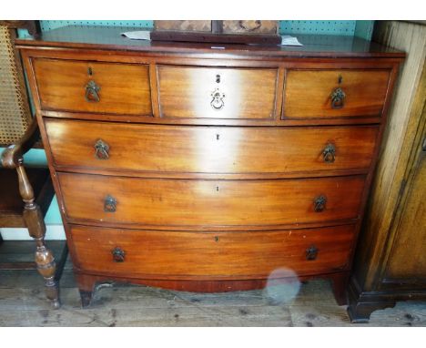 A mahogany bow front chest, having three short over three graduated long drawers on four splayed supports, 113cm wide.