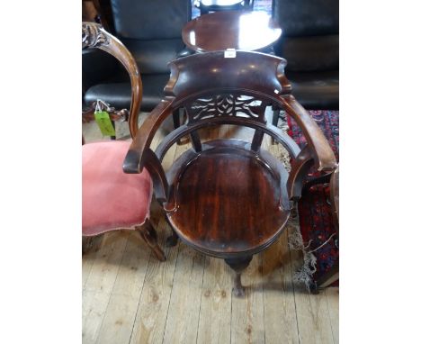 A late 19th century mahogany swivel smokers bow chair, united by X-stretcher. Condition Report: Lots of wear and scratches to