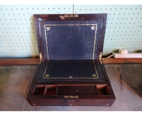 A rosewood writing slope, having inlaid mother of pearl and brass decoration, 35cm x 23cm x 11cm.