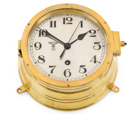 A KRIEGSMARINE U-BOAT CLOCKthe 6¼in. silvered dial marked with Kriegsmarine device, black spade hands with sweep seconds and 