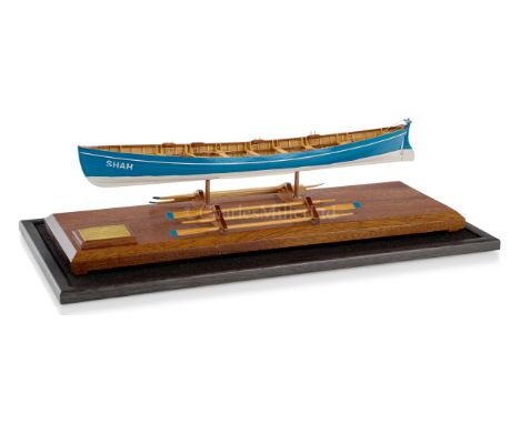 A ½IN:1FT SCALE MODEL OF THE PILOT GIG SHAH [1826]modelled in fruit woods, fully framed with 14 in. clinker-built hull with b