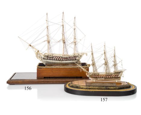 AN EARLY 19TH CENTURY NAPOLEONIC FRENCH PRISONER OF WAR BONE SHIP MODELwith 6½in. planked and pinned hull, red painted gun po
