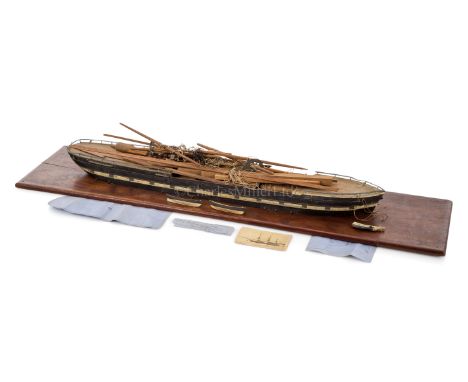 AN UNFINISHED SAILOR'S MODEL OF THE S.V. NORFOLK, CIRCA 1900the 28in. carved and painted waterline hull together with a quant