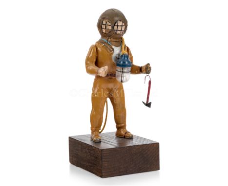 TINPLATE MODEL DIVER BY FLEISCHMANN, CIRCA 1920 depicted with hatchet and lamp, finished in polychrome and mounted on wooden 
