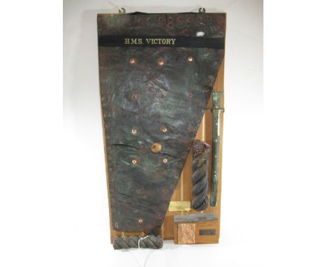 A SECTION OF COPPER SHEATHING FROM H.M.S VICTORYwith old wear and securing holes, now mounted to display board with sections 