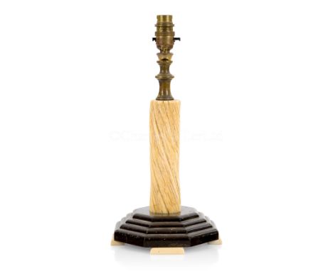 Ø A NARWHAL TUSK LAMP STANDwith 7in. narwhal tusk section supporting brass lamp fixture on stepped octagonal base with marine