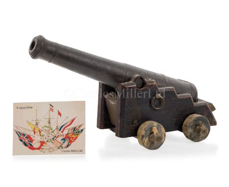A CAST IRON MODEL FOR A NAVAL GUN, CIRCA 1850with 15in. four stage tapering barrel, with touch hole, mounted on stepped woode