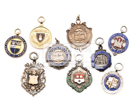 Nine medals relating to football in Southern England,including a cased 9ct. gold & enamel Hampshire F.A. Senior Cup winners 1