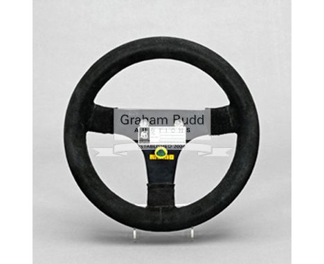 Elio de Angelis' 1983 Italian GP Lotus-Renault 94T F1 steering wheel,the rim bound in black suede, the metal boss with three 