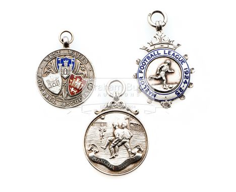 Three medals relating to football in Wales,i) silver & enamel West Wales F.A. Amateur Cup runners-up, undated; ii) silver Mae