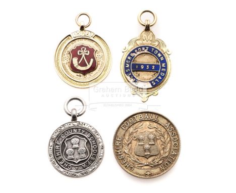 Three early football medals won by Joe Mercer,a silver Cheshire County Schools' F.A. medal, hallmarked 1928; a 9ct. gold & en