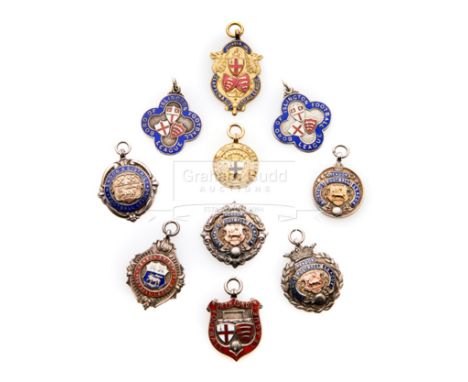 Ten medals relating to football in London,comprising a cased 9ct. gold & enamel London F.A. Mid-Week Cup medal, undated; five